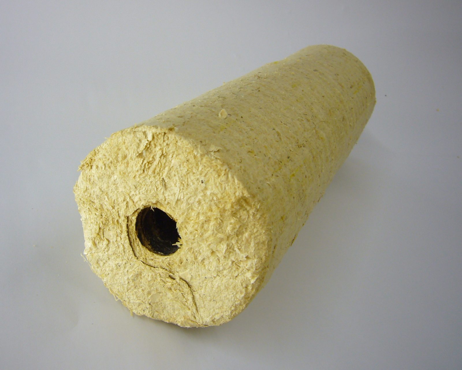 Compressed cylindrical wood biomass briquettes