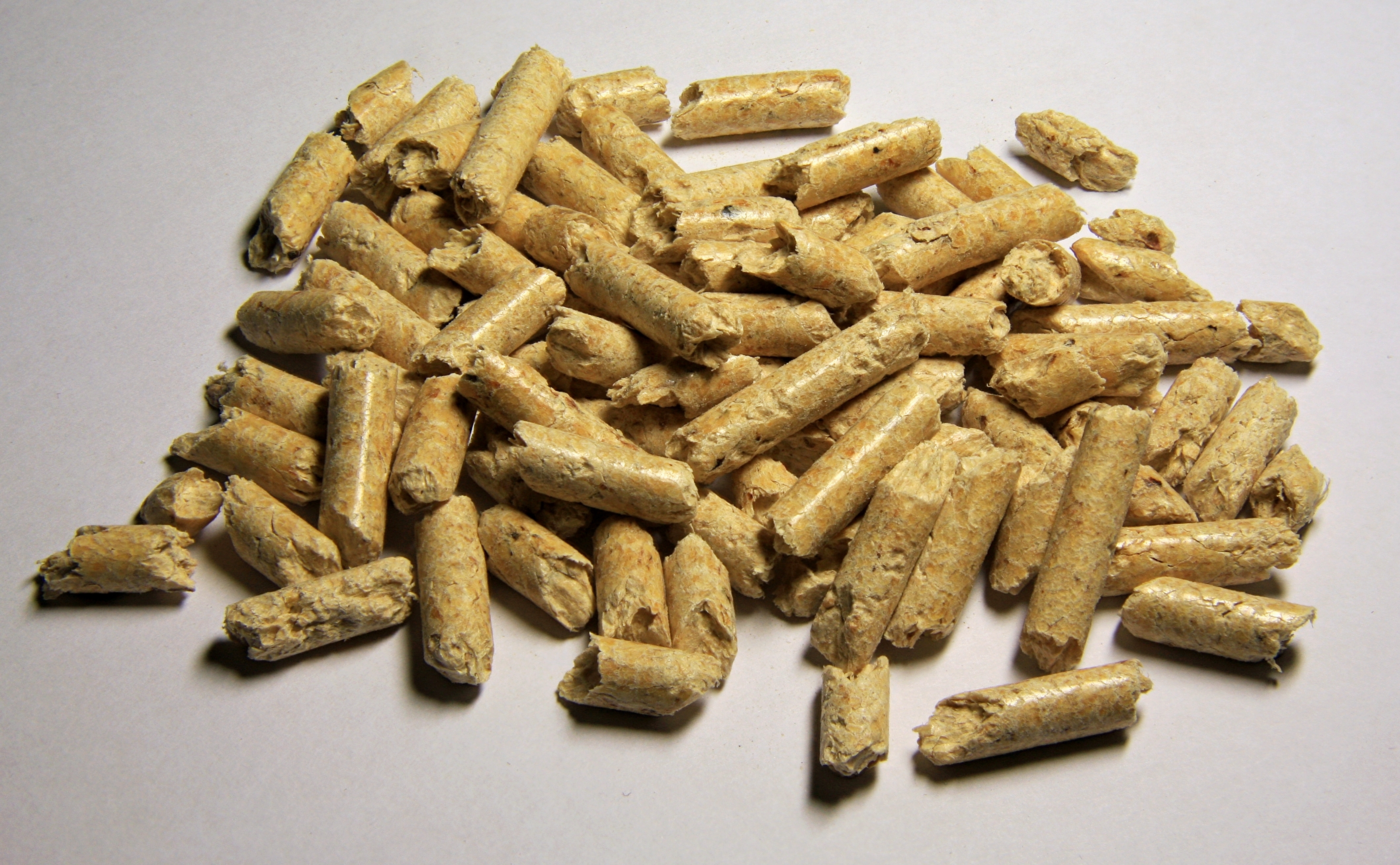A pile of compressed biomass fuel pellets
